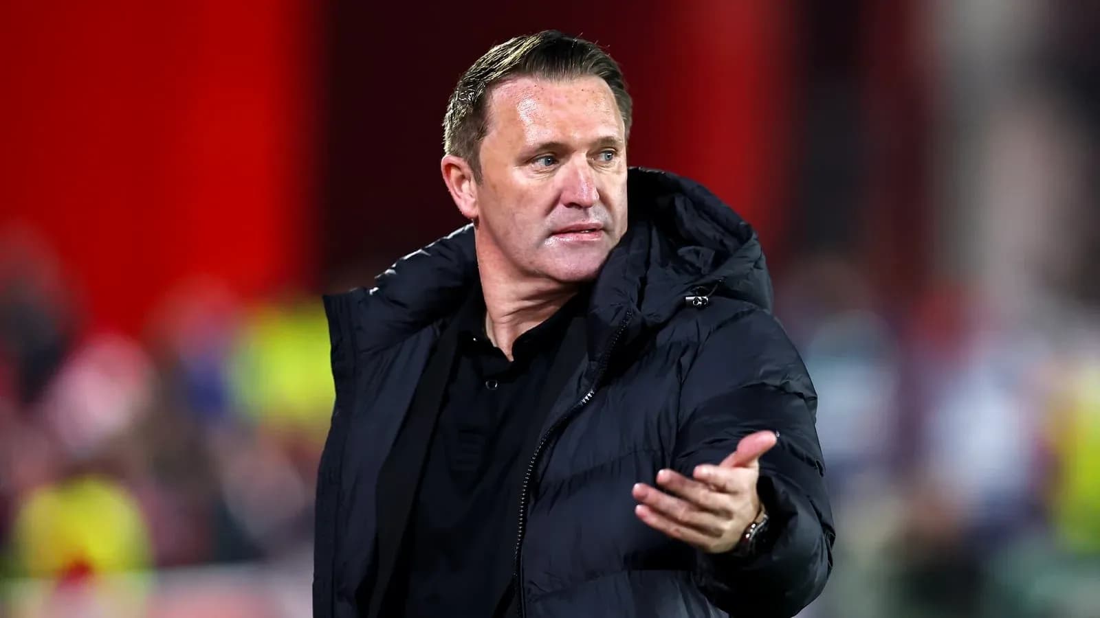 Manager gesturing during a football match on the sideline Manager gesturing during a football match on the sideline