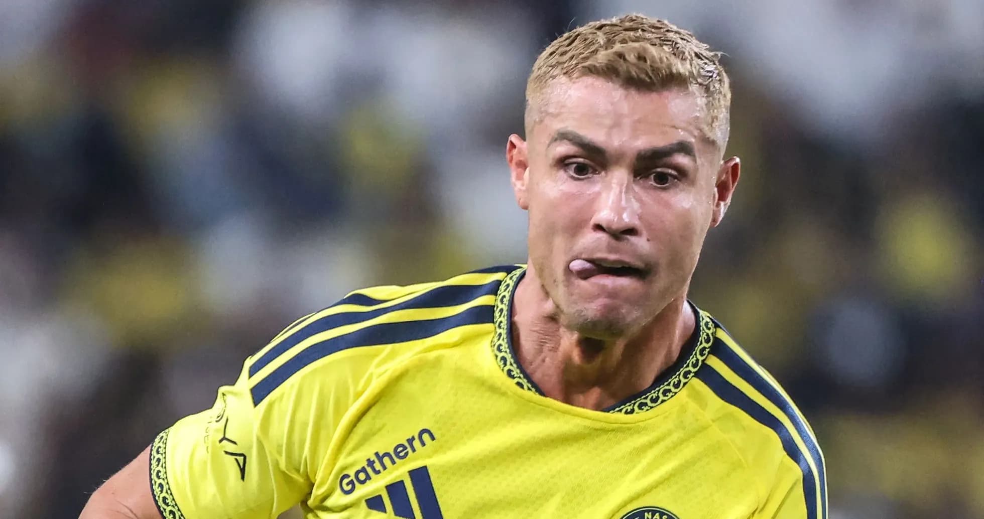 Player in yellow jersey running during match Player in yellow jersey running during match