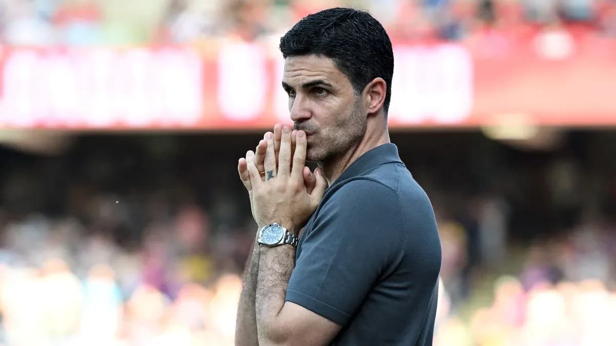 Manager observing the match with hands clasped Manager observing the match with hands clasped