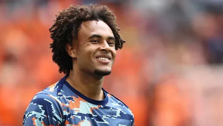 Player smiling in warm-up jersey on field Player smiling in warm-up jersey on field
